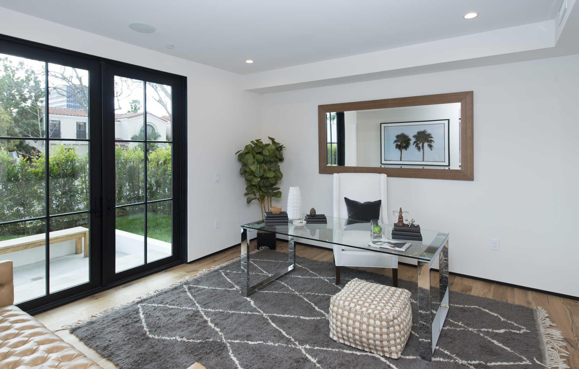 Home office with steel-frame French doors to the side yard
