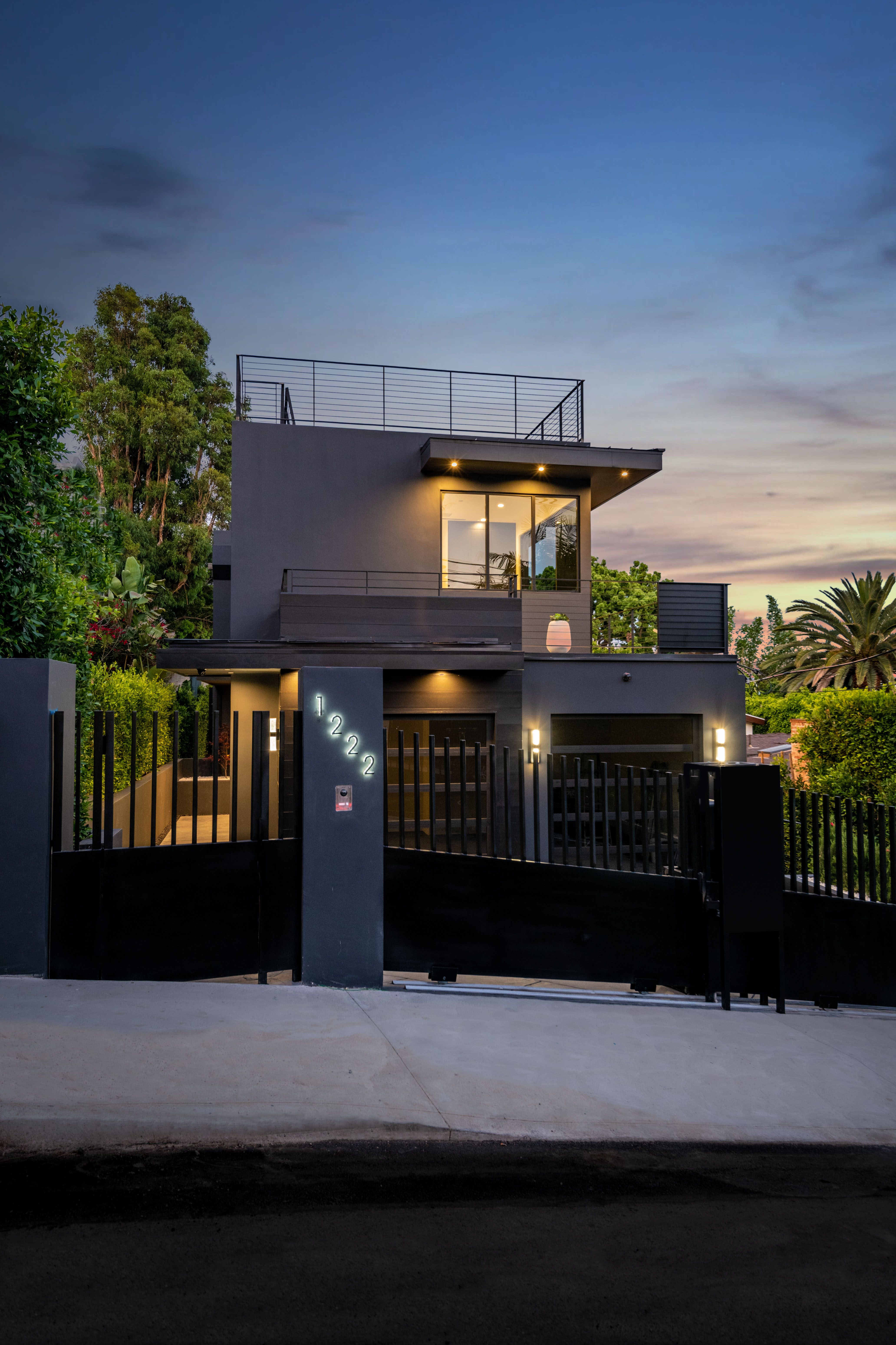 Hilldale residence at 1222 — black stucco front exterior