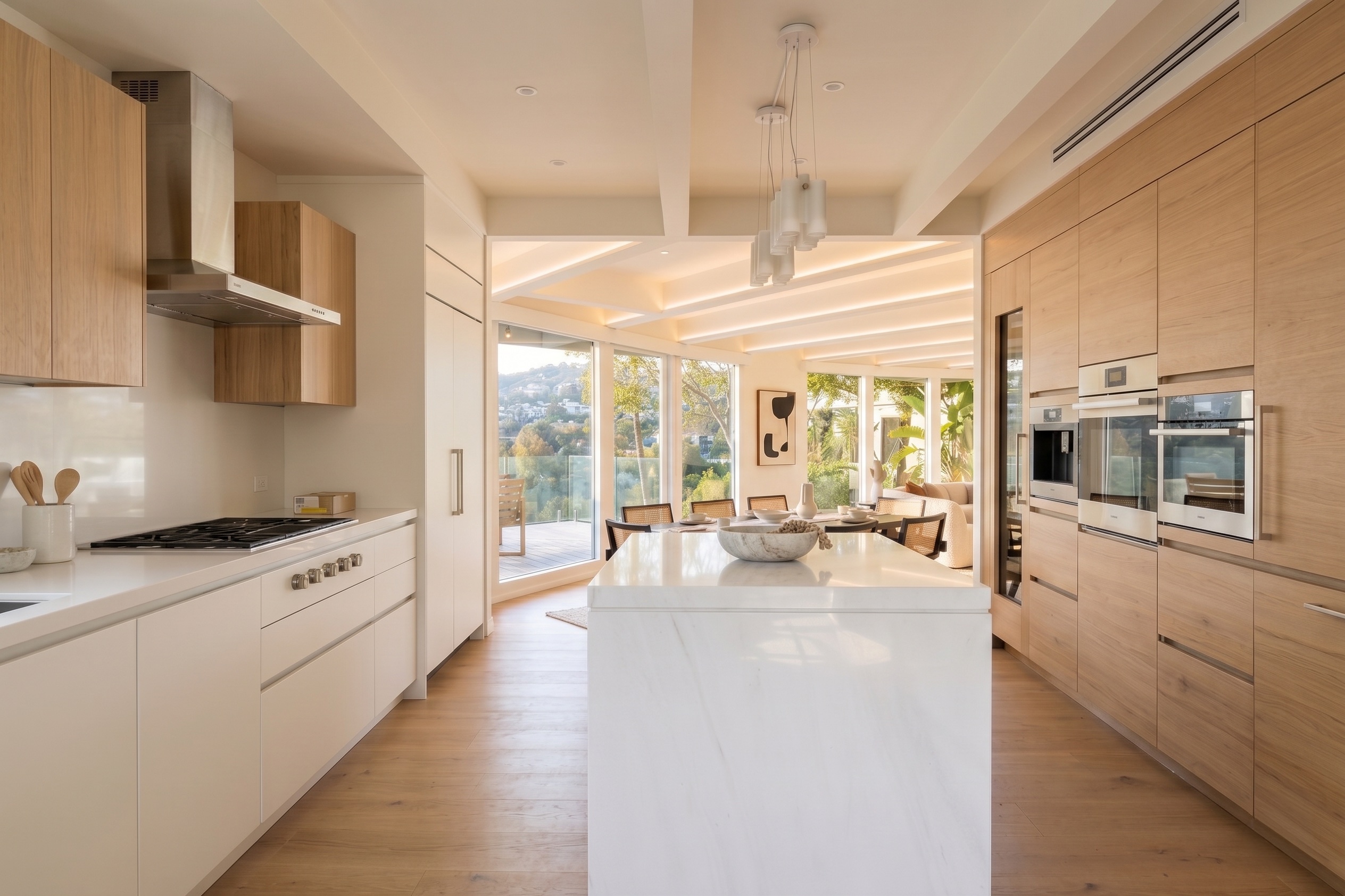 Contemporary kitchen with island and integrated appliances