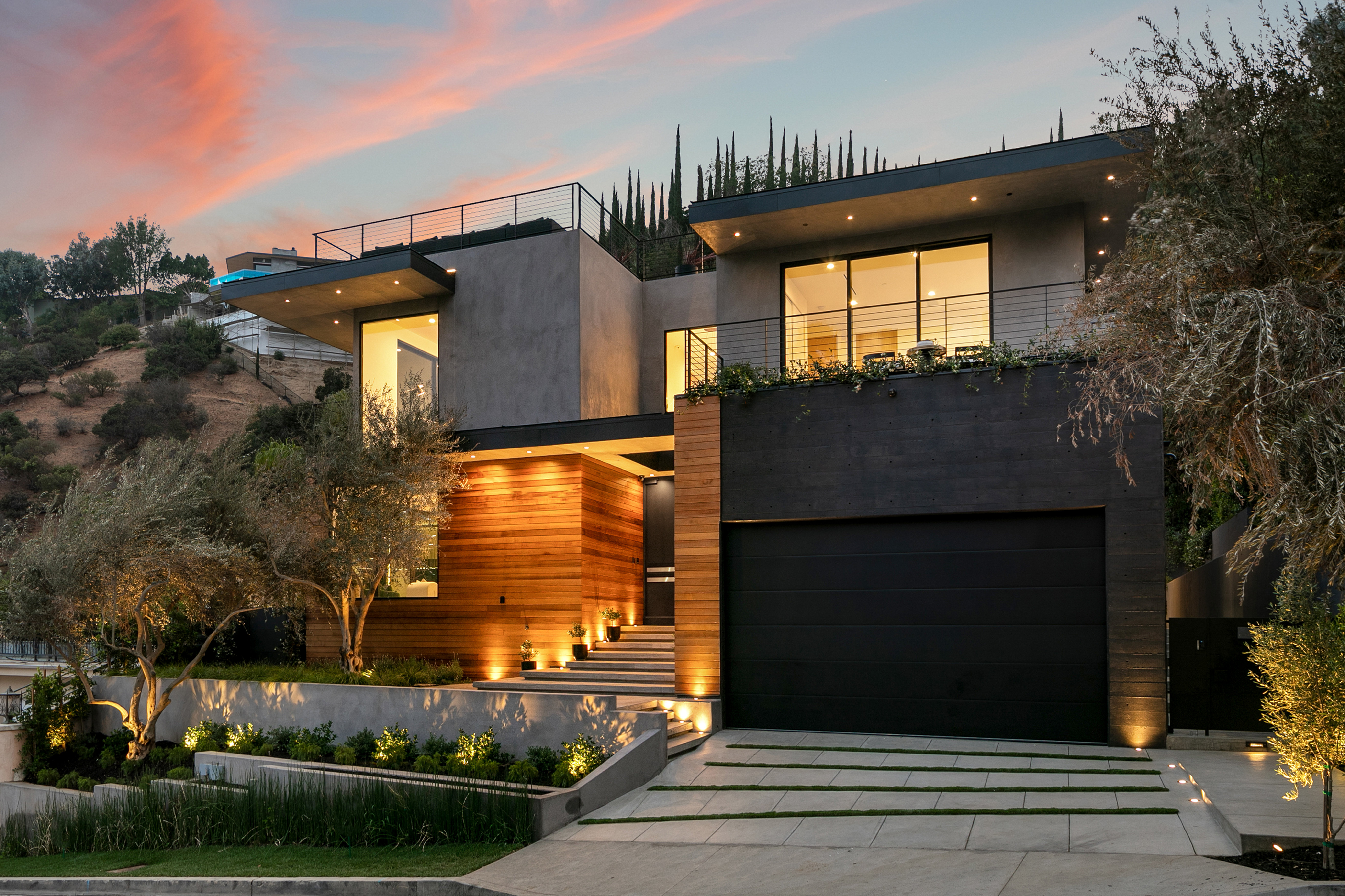 Rising Glen I residence — twilight exterior with pool and Los Angeles city view