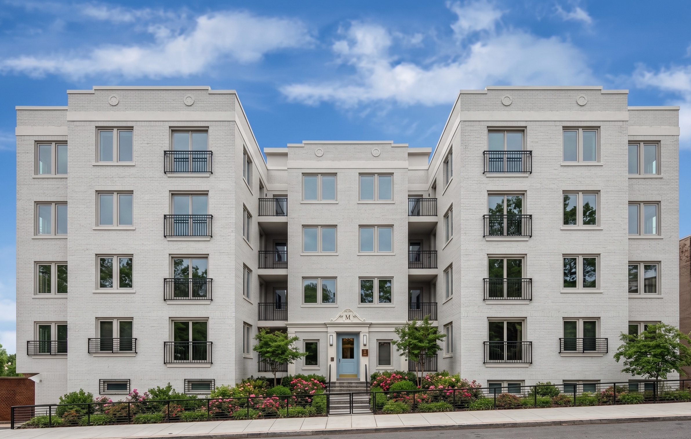 The Mint — classical white-brick condominium renovation