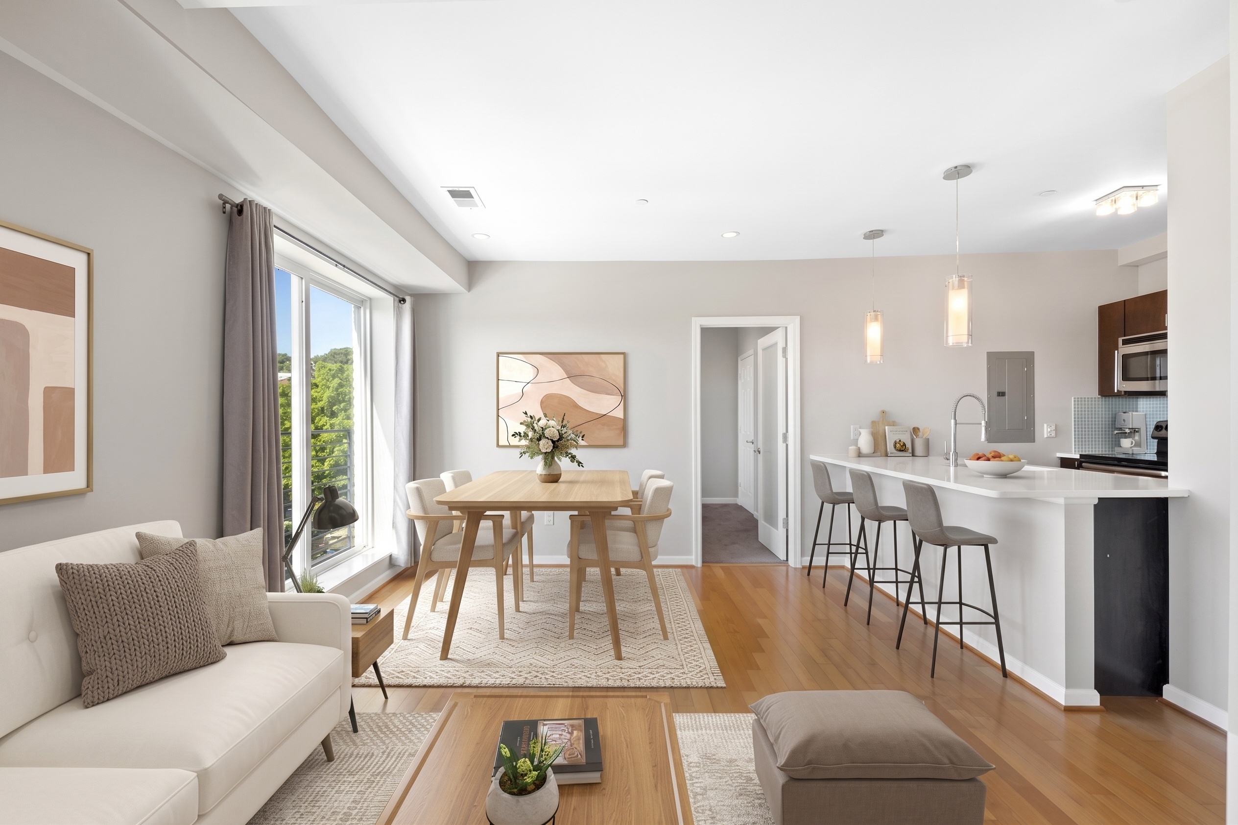 Light-filled living room and dining set with kitchen bar counter